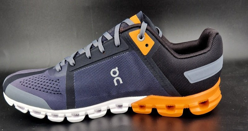 On Running Cloudflow Black/Turmeric men - Winzer Gesunde Schuhe